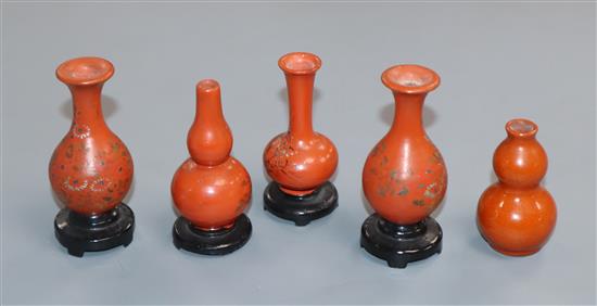 A group of four Chinese lacquer wood miniature vases and a similar pottery double gourd vase (5)